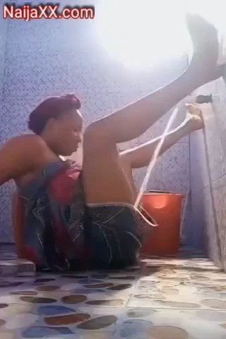 African lady Using tap wat to satisfy her horny self